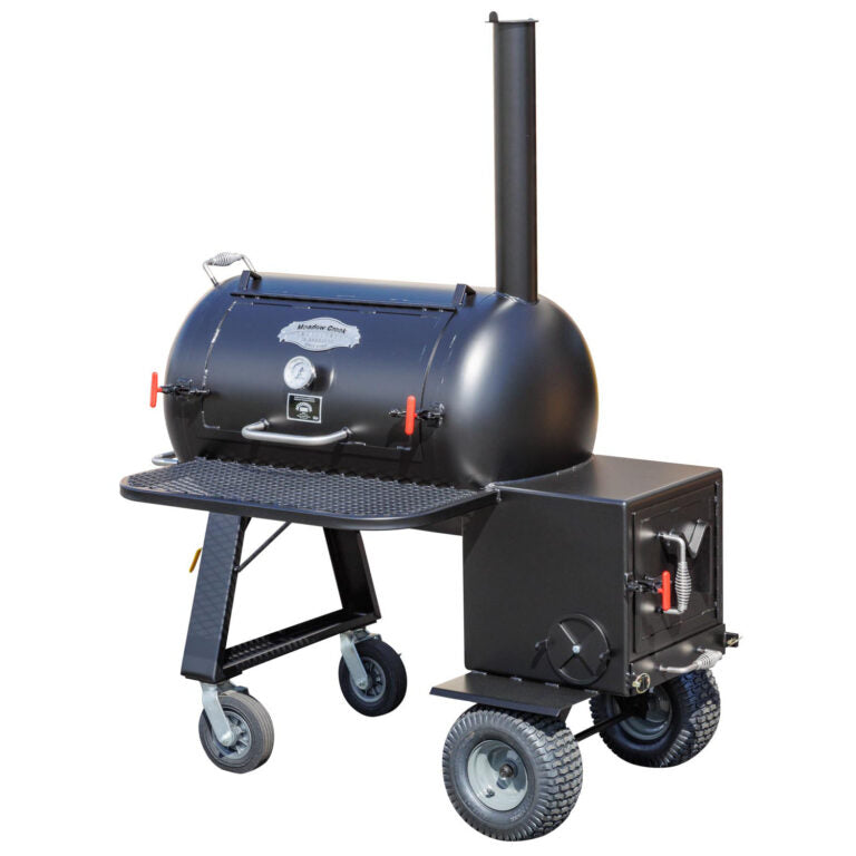 A large, black Meadow Creek BBQ smoker on wheels with a cylindrical body, a chimney, and various handles and latches. The smoker has a small shelf on the front and is mounted on a sturdy frame with two different sets of wheels for mobility.