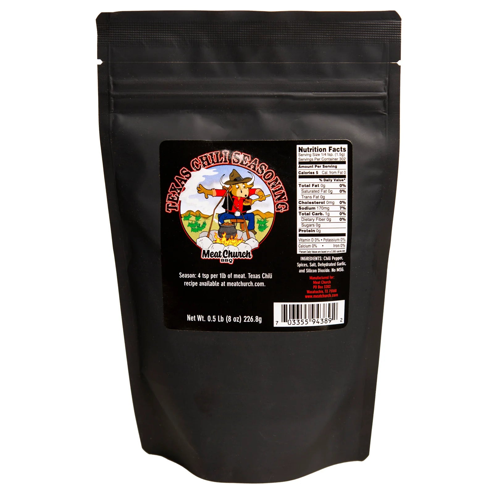An 8-ounce black bag of Meat Church Texas Chili Seasoning. The label features a cartoon cowboy holding a pot of chili, with a background of a Texas landscape. The bag includes nutrition facts, a barcode, and a recipe suggestion. The seasoning is a coarse, dark red powder.