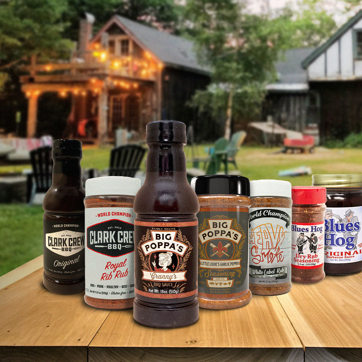 Image with grouping of sauces and BBQ seasonings from Big Poppa Smokers, Clark Crew BBQ, Heavy Smoke, Blues Hog