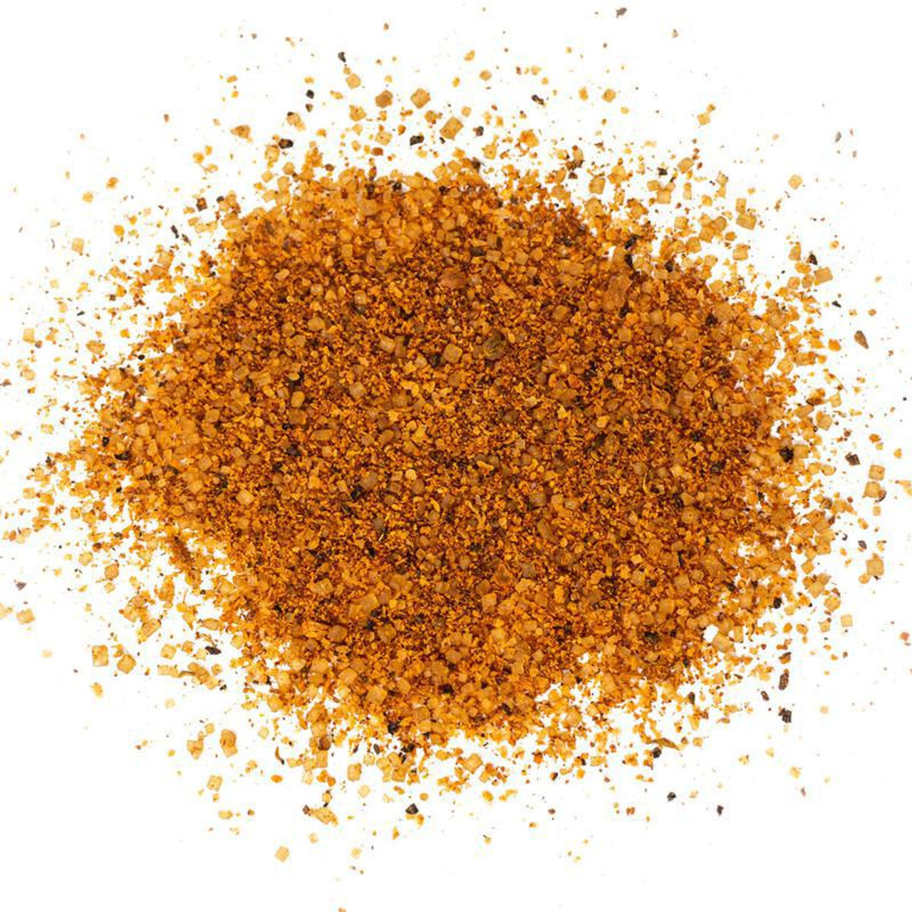 A close-up view of a pile of Tuffy Stone Classic BBQ Rub Sweet Heat seasoning, showcasing its coarse, orange-brown texture.