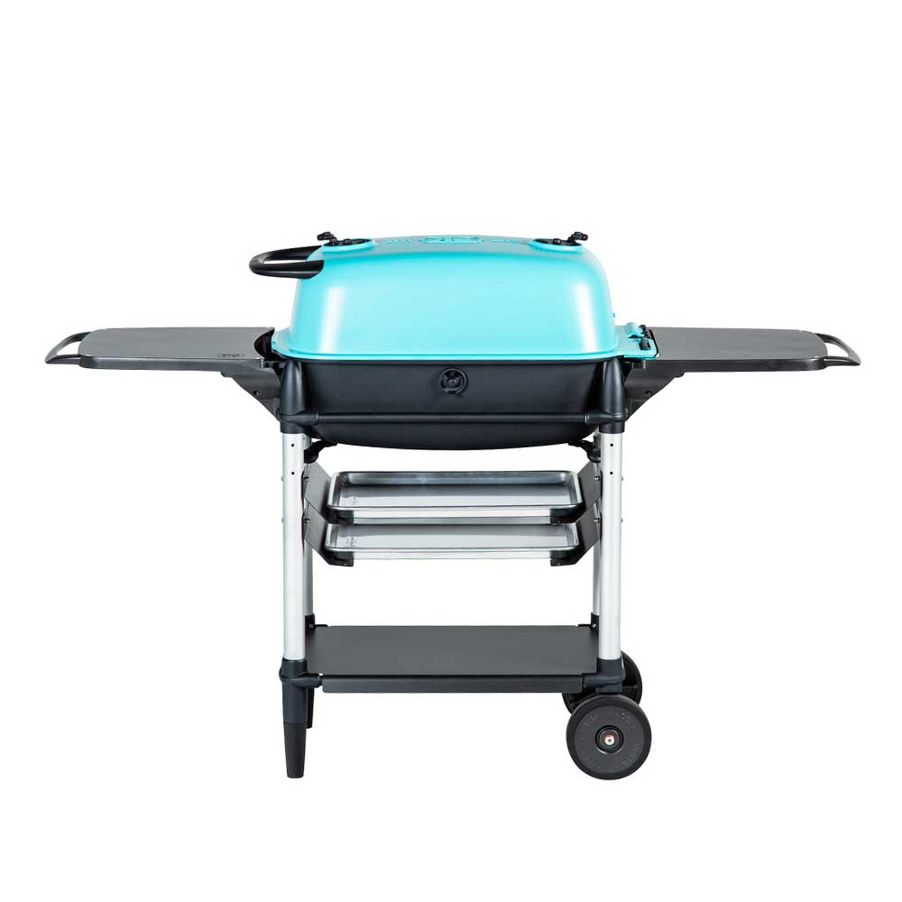 Back view of a PK Franklin charcoal grill with a teal lid. The grill features side shelves, two trays below the grilling area, and a lower storage shelf. One side of the grill is on wheels for easy mobility.