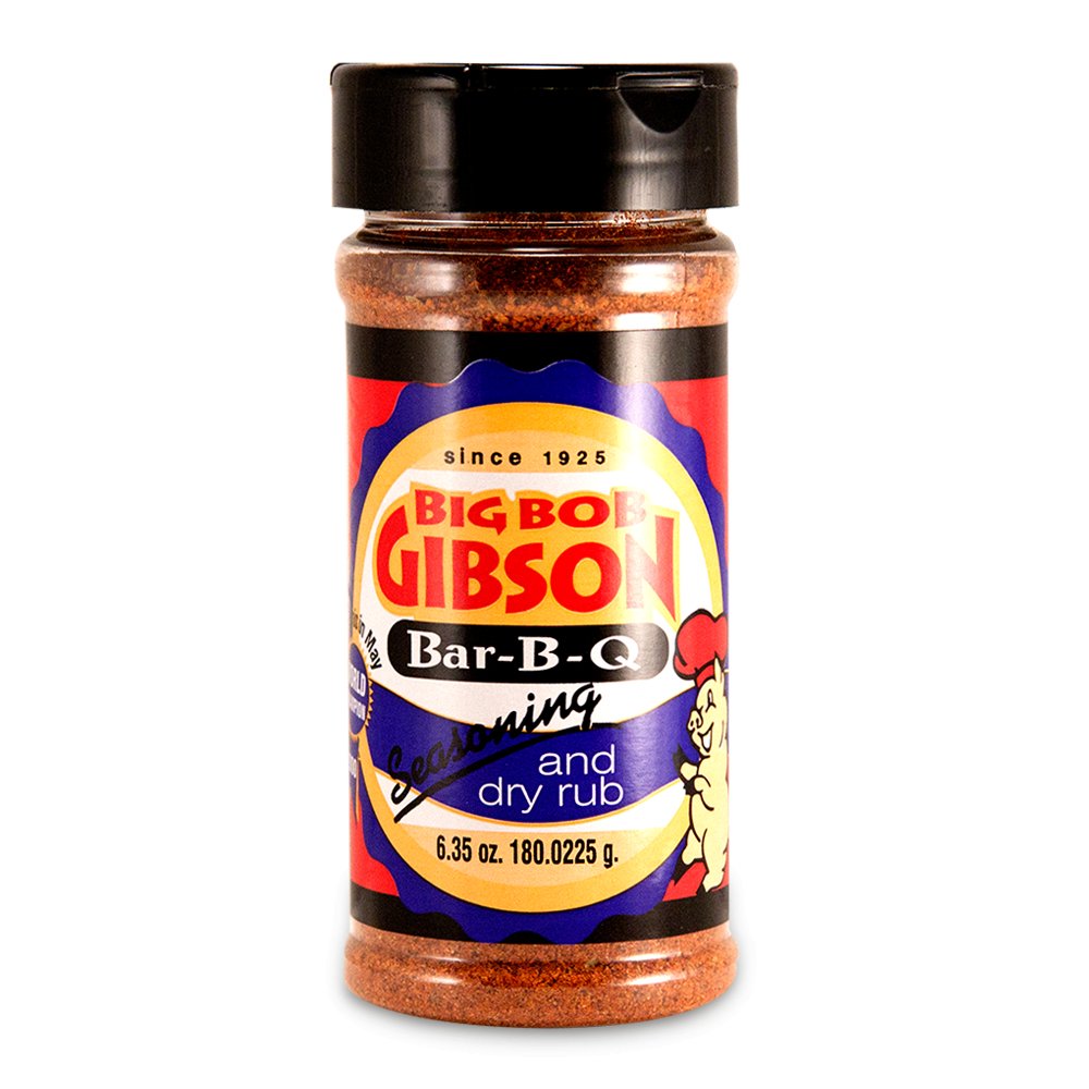 Big Bob Gibson Bar-B-Q Seasoning and Dry Rub in a 6.35 oz bottle. The label displays the brand name in red with a yellow background and includes a cartoon chef on the right. The seasoning inside is a reddish-brown color.