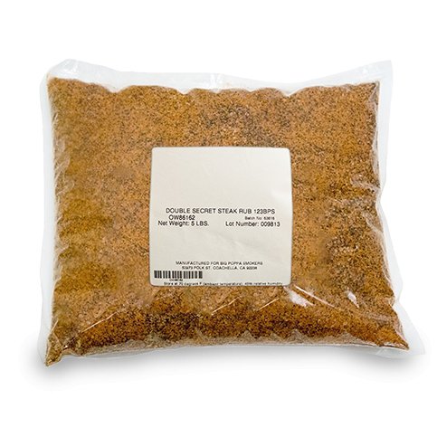 Packaged clear plastic bag filled with a fine, reddish-brown seasoning labeled as 'Double Secret Steak Rub,' showing a net weight of 5 lbs.