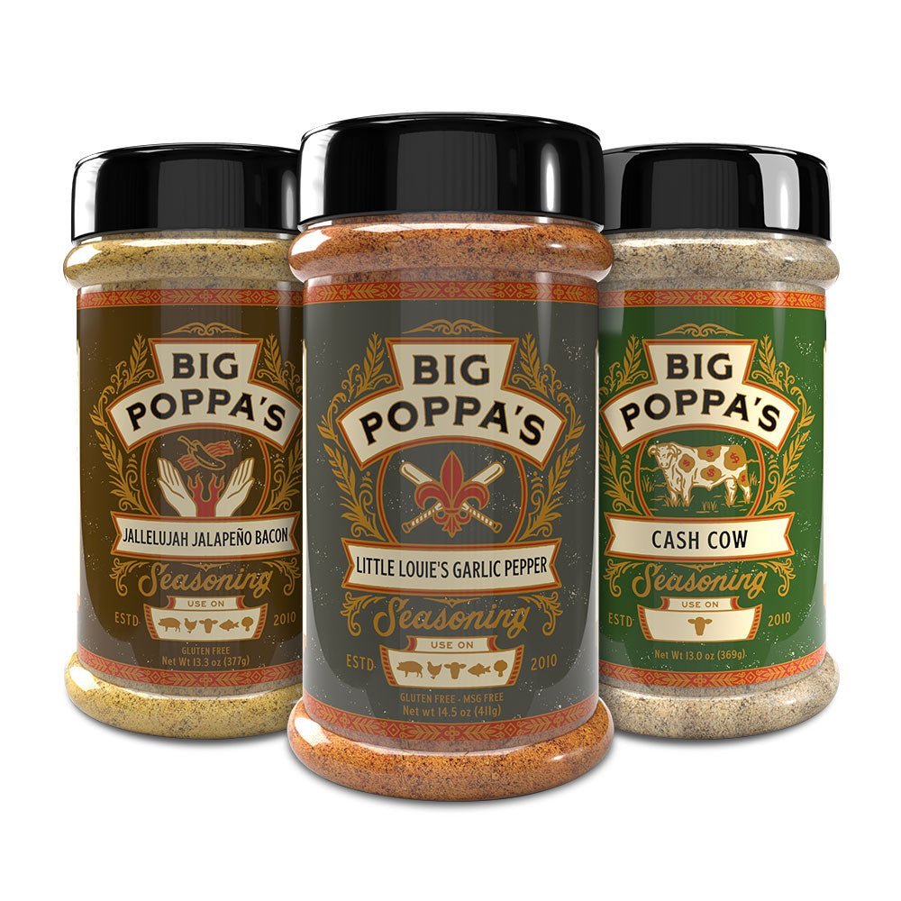 Three jars of Big Poppa’s blends: Jallelujah Jalapeño Bacon, Little Louie’s Garlic Pepper, and Cash Cow with ornate labels.