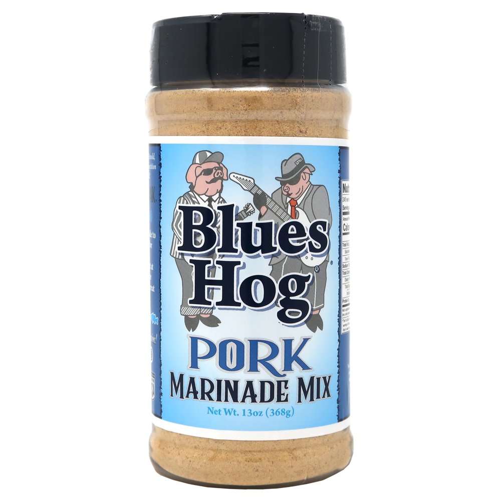 The front of a jar of Blues Hog Pork Marinade Mix with a black lid. The label features the Blues Hog logo with two cartoon pigs dressed as musicians. The label reads 'Blues Hog Pork Marinade Mix' and indicates the net weight of 13 ounces (368 grams).