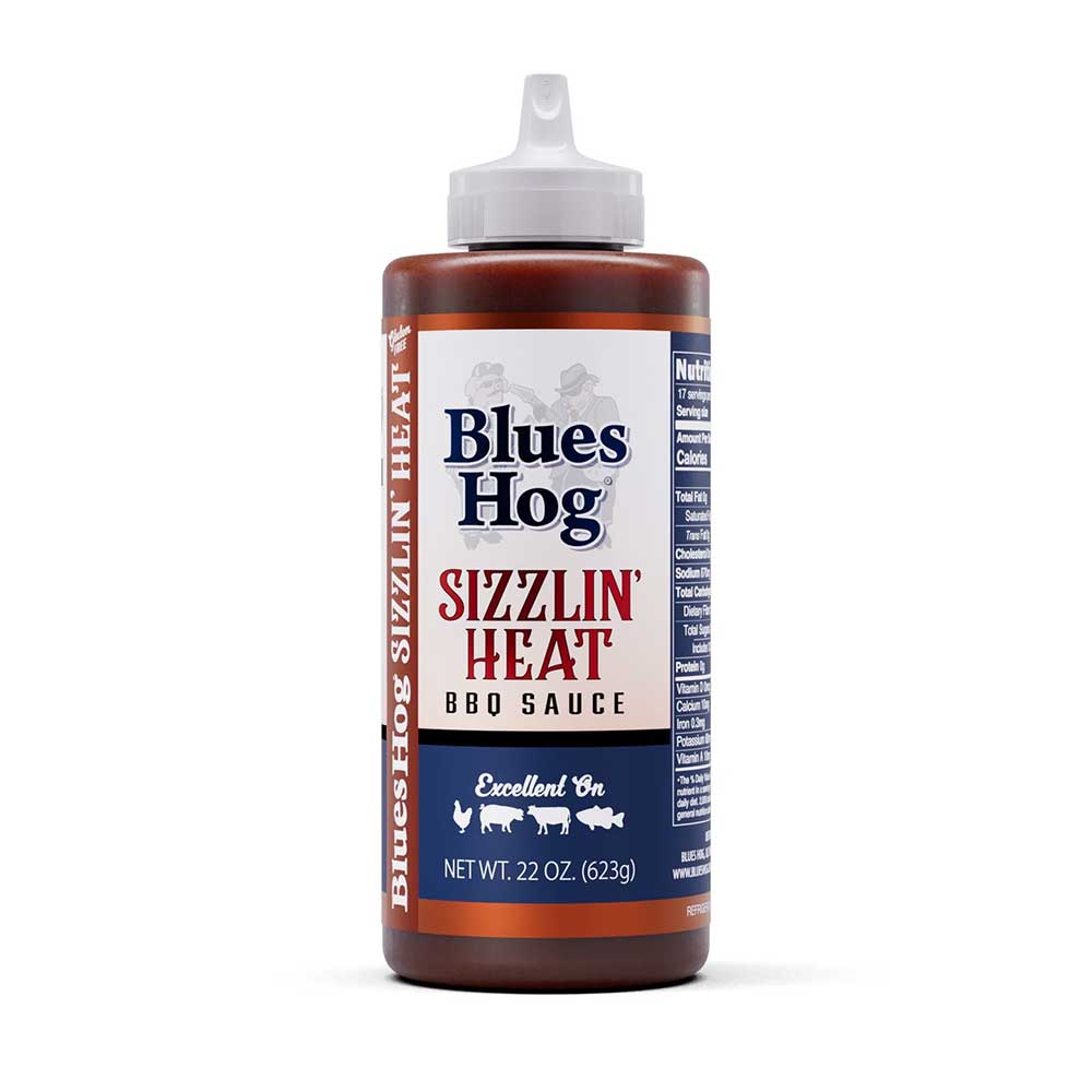 Blues Hog Sizzlin’ Heat BBQ Sauce, 22 oz squeeze bottle, labeled "Excellent On" various meats.
