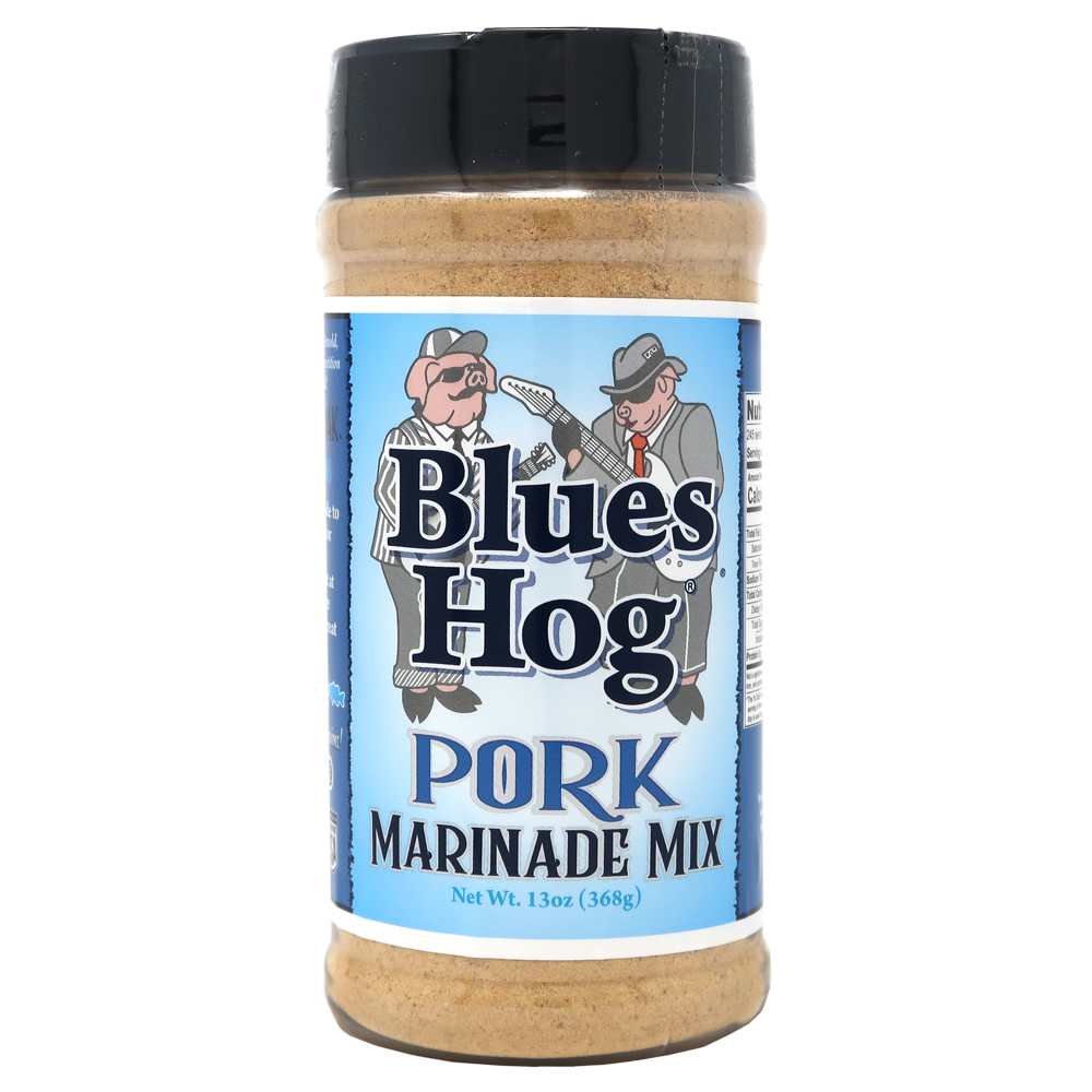 The front of a jar of Blues Hog Pork Marinade Mix with a black lid. The label features the Blues Hog logo with two cartoon pigs dressed as musicians. The label reads 'Blues Hog Pork Marinade Mix' and indicates the net weight of 13 ounces (368 grams).