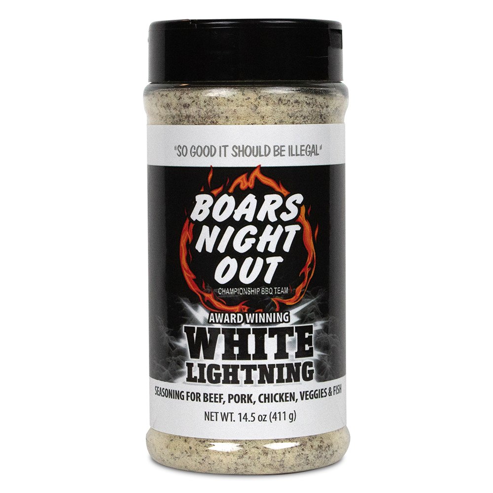 The front of a jar of Boars Night Out White Lightning seasoning with a black lid. The label features the text 'So good it should be illegal' at the top, followed by the Boars Night Out logo with a flaming design. Below, the label reads 'Award Winning White Lightning' and specifies that the seasoning is for beef, pork, chicken, veggies, and fish. The net weight is 14.5 ounces (411 grams).