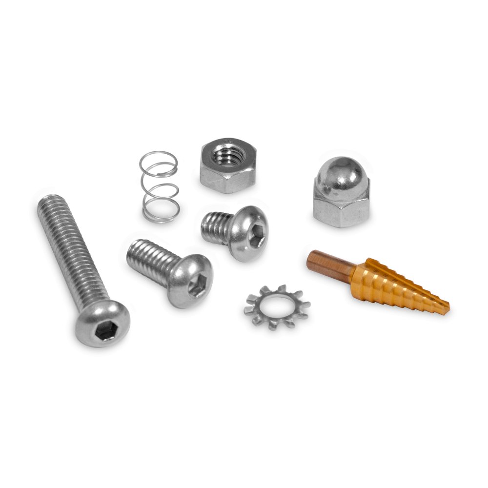 A close-up of various metallic hardware components of a smoker kit. This includes screws, nuts, a spring, a gear-shaped piece, and a unique orange-tipped piece, all arranged on a dark background.