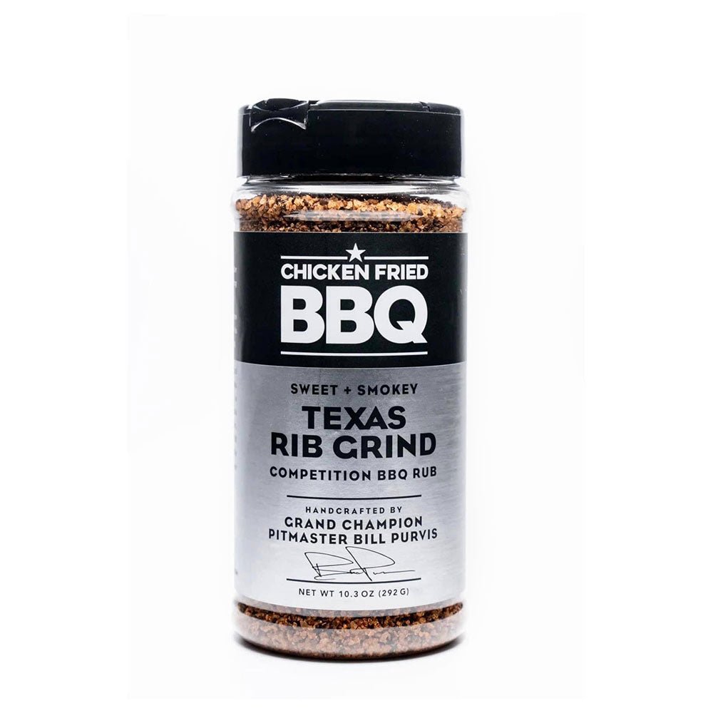 The front of a spice bottle labeled "Chicken Fried BBQ Texas Rib Grind" with a description indicating it is a sweet and smokey competition BBQ rub handcrafted by Grand Champion Pitmaster Bill Purvis.