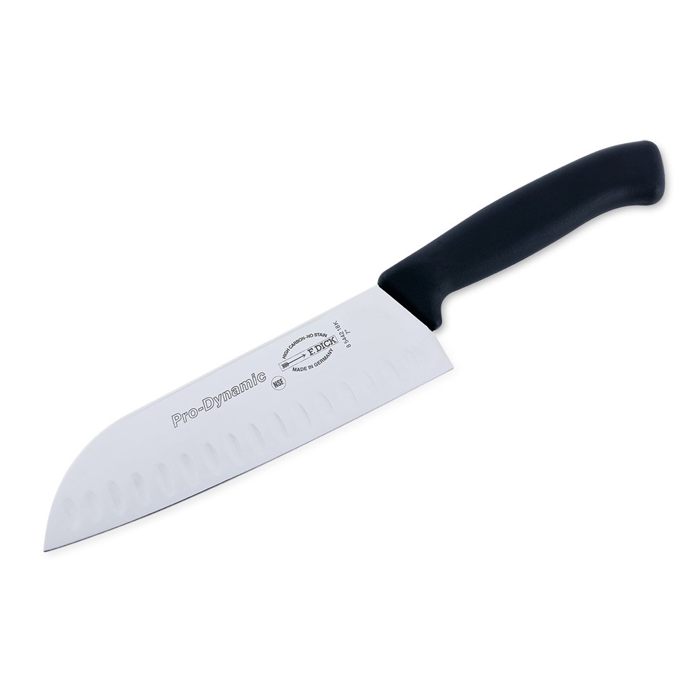 Close-up image of the F. Dick 7" Santoku Kullenschliff - ProDynamic. The knife features a high-carbon stainless steel blade with a kullenschliff edge to prevent food from sticking. It has a black ergonomic handle designed for comfort and control. Displayed on a plain white background, highlighting its sharpness and professional design.