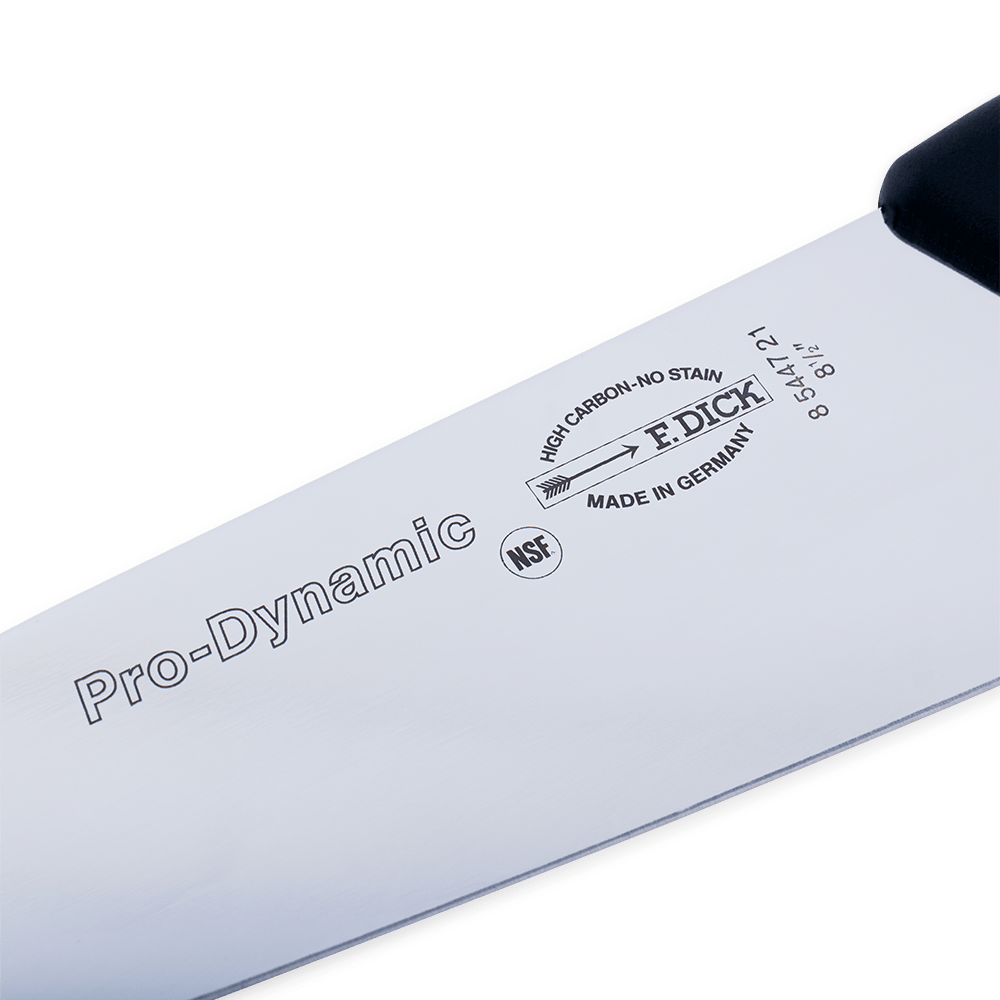 Close-up of a "Pro-Dynamic" chef’s knife blade with brand markings