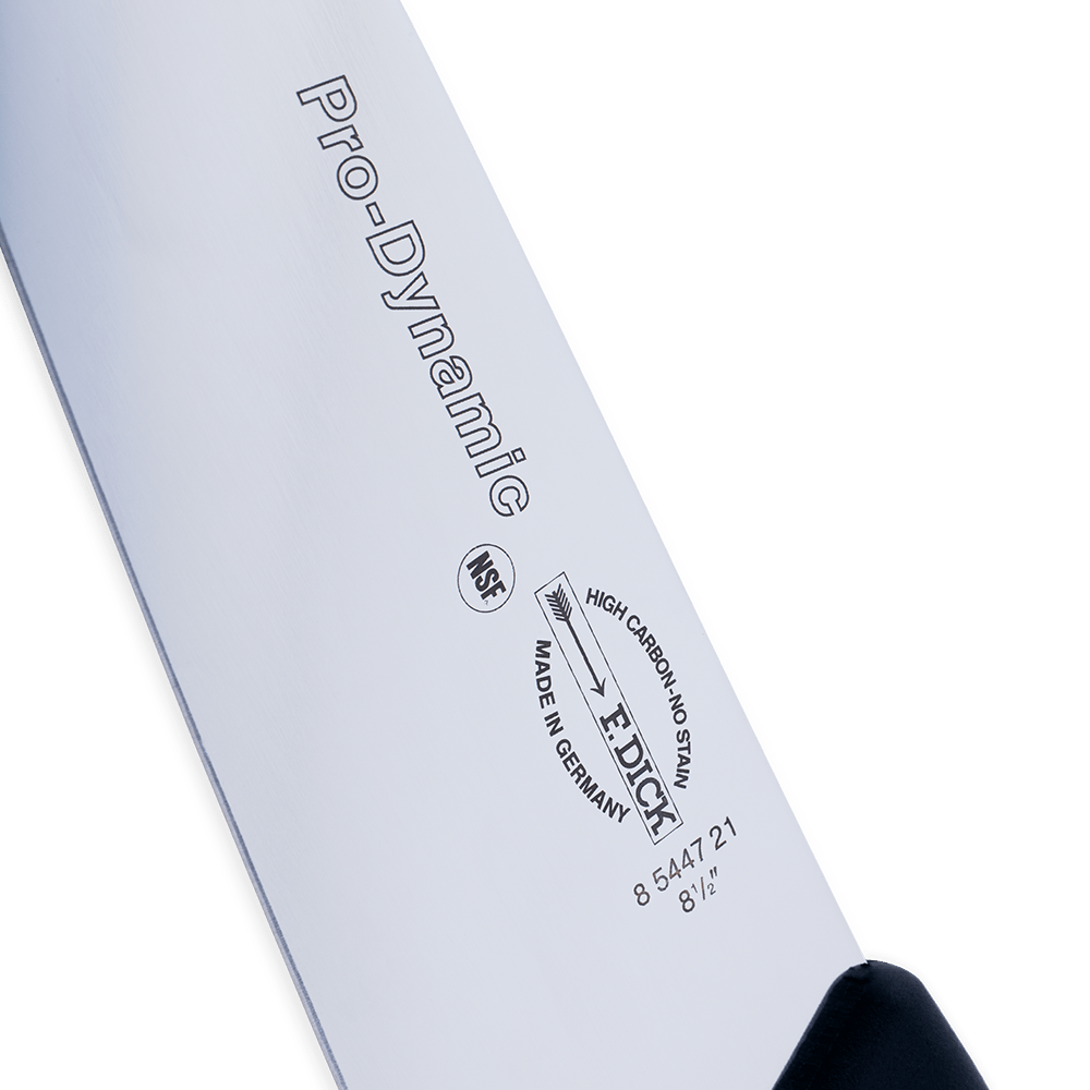 Side close-up of a "Pro-Dynamic" chef’s knife blade with brand markings
