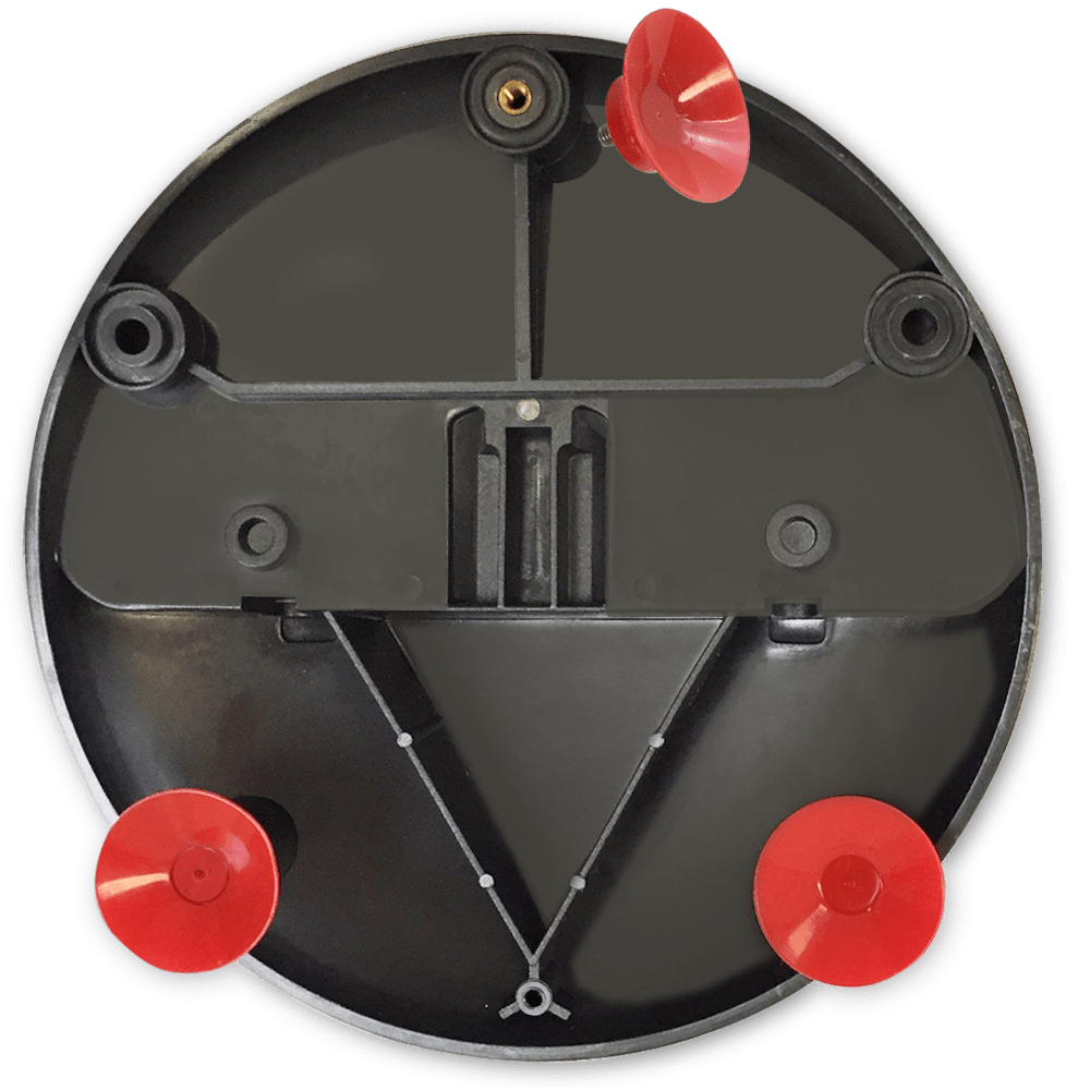 Bottom view of a black plastic base with red suction cups attached.
