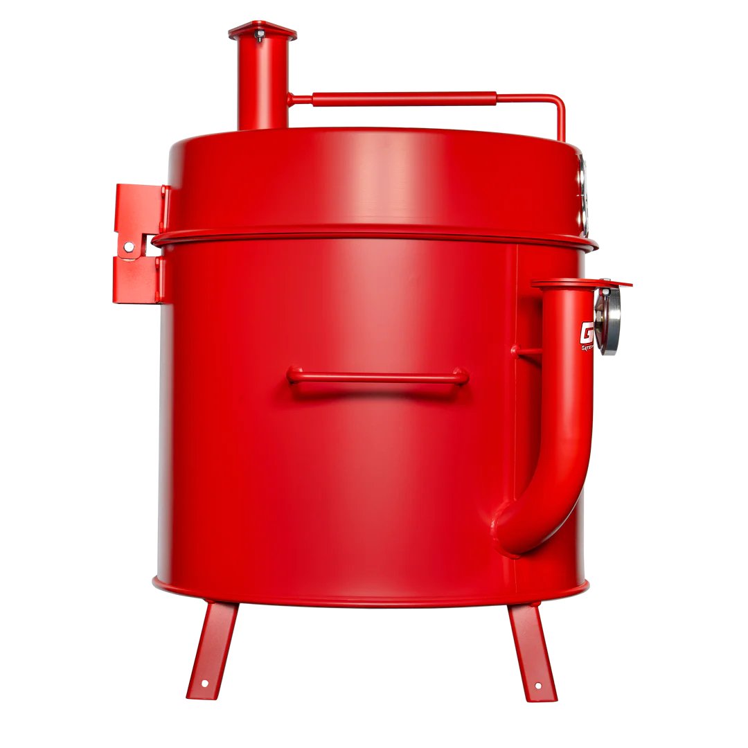 The side view of a red mini drum smoker, displaying its simple, cylindrical design with a smoke stack on top.