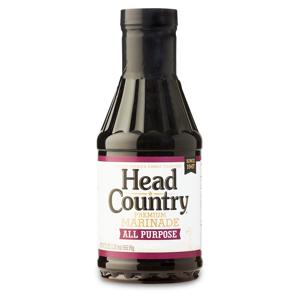 Bottle of Head Country's Premium BBQ Marinade, labeled as the best in the nation for enhancing the flavors of beef, chicken, and pulled pork. Free from MSG, gluten, and trans fats, ensuring a healthy and delicious addition to any BBQ dish.