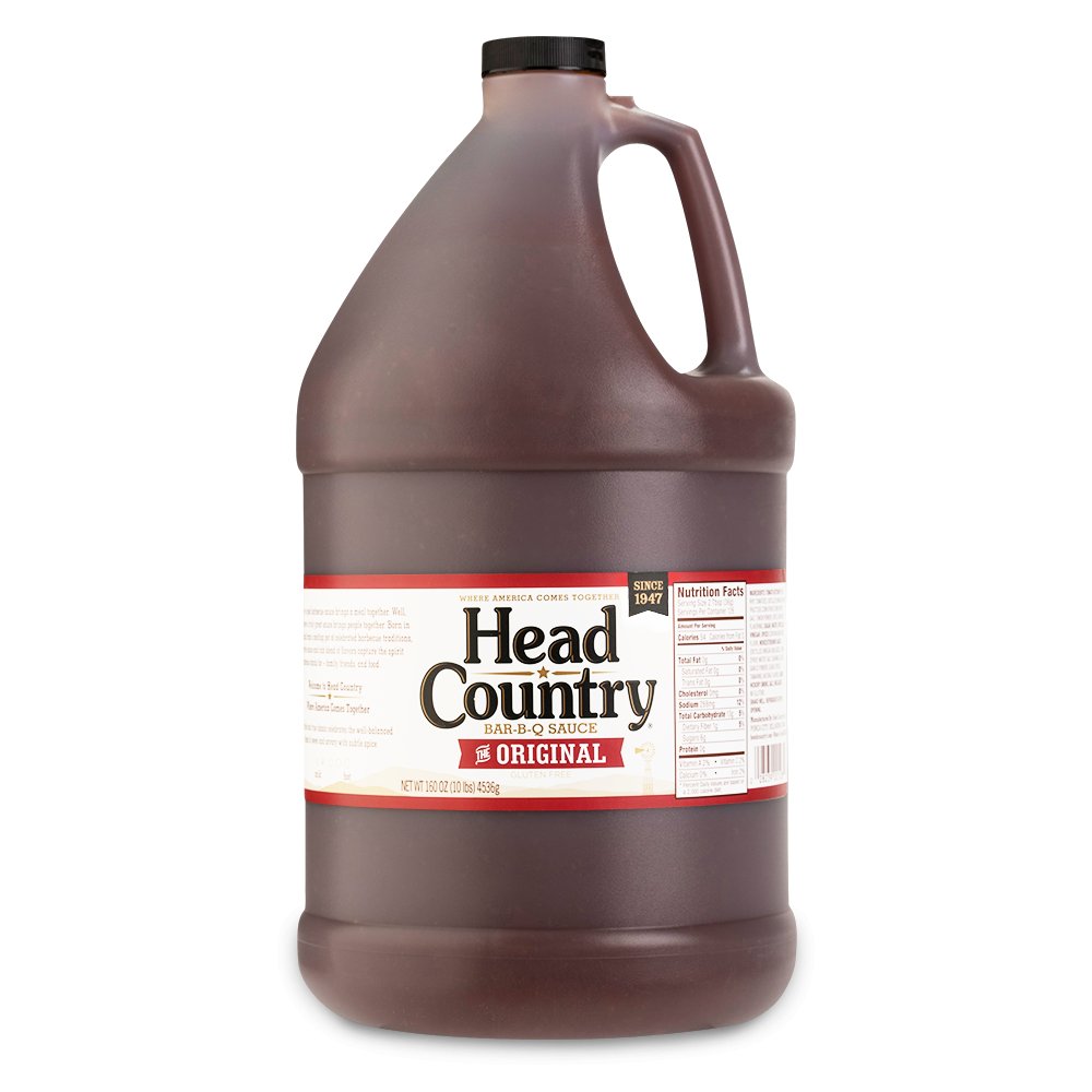 Bottle of Head Country's Original BBQ Sauce, renowned for "Winning Hearts & Championships Since 1947." This all-natural, gluten-free, tomato-based sauce is perfect for glazing, basting, or grilling any meat, promising a championship taste every time.