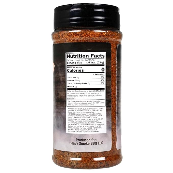 The back of an 11-ounce container of Heavy Smoke Black Label Rub showing the nutrition facts label. The label indicates that the rub has 0 calories, 0g of total fat, 95mg of sodium, 0g of total carbohydrates, and 0g of protein per 1/4 teaspoon serving. The ingredient list is also visible, including salt, sugar, various spices, and other flavorings. The container is produced by Heavy Smoke BBQ LLC.