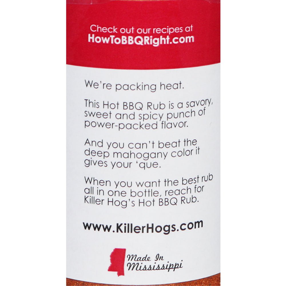 A side view of the Killer Hogs Hot BBQ Rub bottle. The label includes a description of the product, promotional text, and contact information, with social media icons at the top.