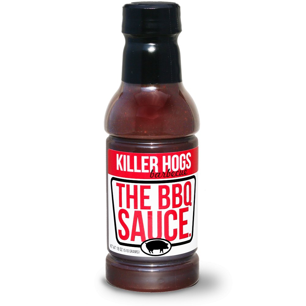 Bottle of Killer Hogs The BBQ Sauce, prominently displaying its label, ideal for adding a flavorful punch to any BBQ dish with its perfect blend of heat, sweetness, and tanginess. Great for both competitive and backyard BBQs.