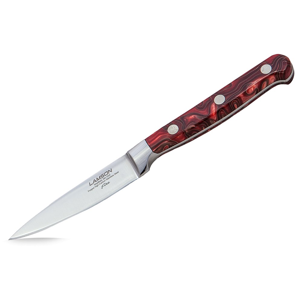 Close-up image of the Lamson 3" Trimming/Boning Knife from the Fire Series. The knife features a high-carbon stainless steel blade with a sharp, precise edge, and a vibrant, fiery-red acrylic handle. Displayed on a cutting board, it highlights its use for trimming and boning meat, perfect for BBQ and kitchen tasks.