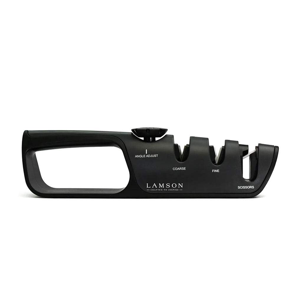 A side view of the Lamson adjustable angle knife sharpener. The sharpener features a black ergonomic design with labeled slots for angle adjustment, coarse sharpening, fine sharpening, and scissors.