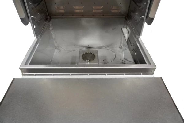 Inside view of a MAK Grills pellet smoker with a clean, empty cooking chamber and visible heating element at the bottom.