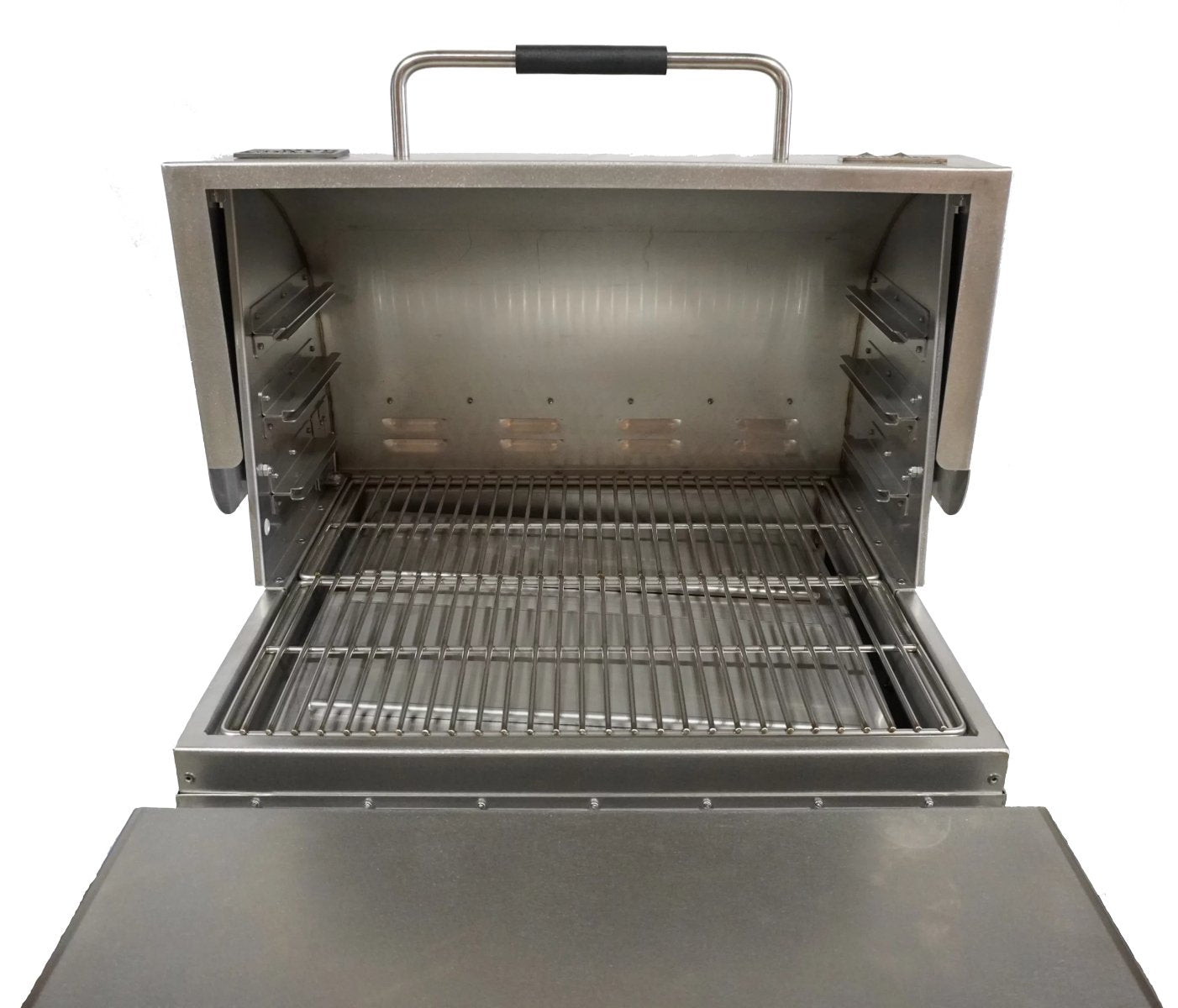 Inside view of a MAK Grills pellet smoker with stainless steel grilling grates and spacious cooking area.