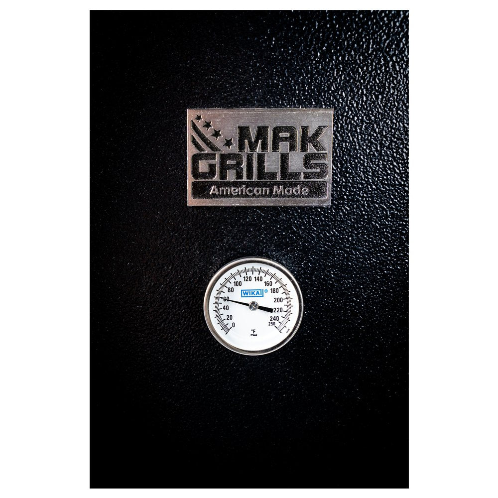 Close-up of the MAK 2 Star Super Smoker Box, highlighting its thermometer and T-handle latch.