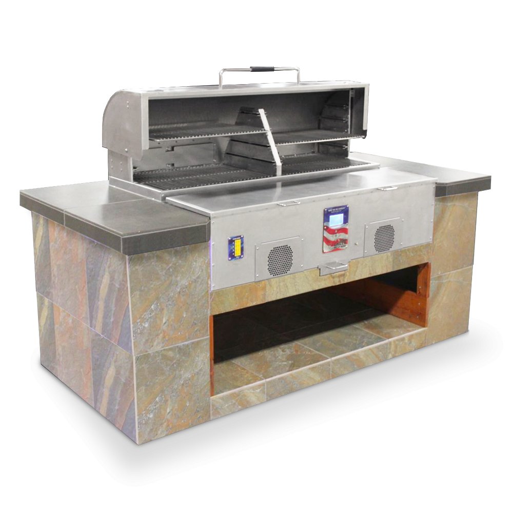 MAK Grills pellet smoker built into a stone-tiled outdoor kitchen counter, with the lid open to reveal the grilling area.