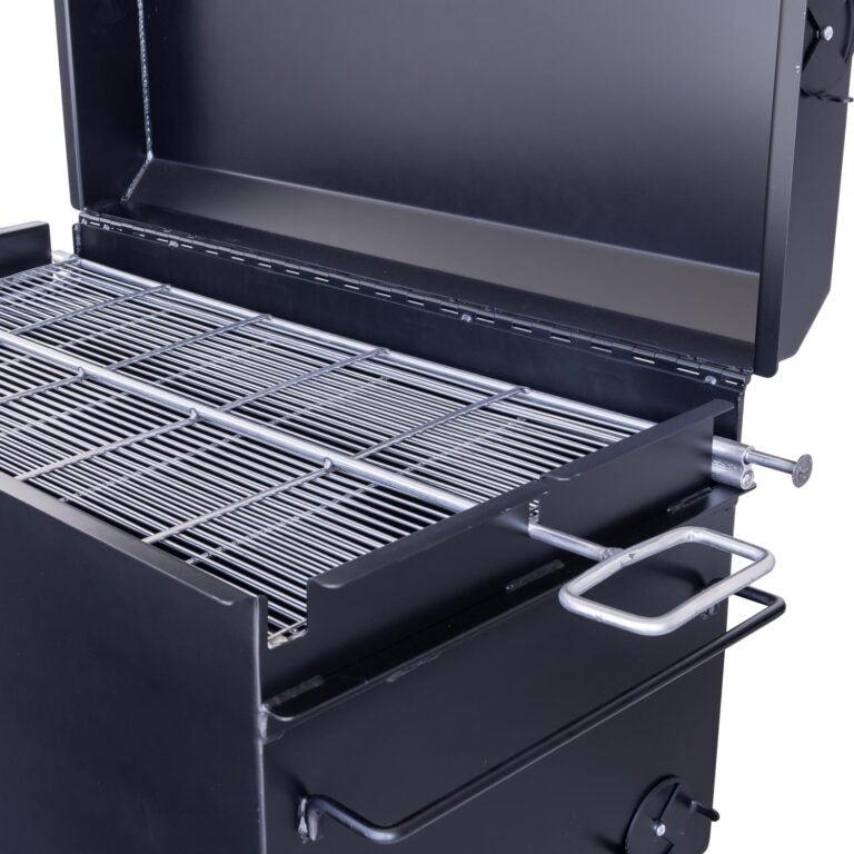 Side view of the Meadow Creek BBQ42 Chicken Cooker with the lid open, revealing the spacious cooking grate. The cooker is mounted on a sturdy frame with large tires for mobility.