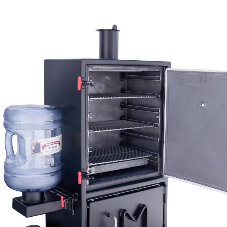 Close-up of the Meadow Creek BX25 Box Smoker with the upper compartment open, showing the stainless steel grates and the attached water bottle.