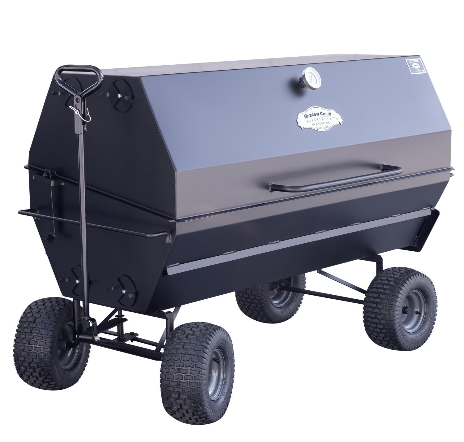 The Meadow Creek PR60 pig roaster on a wagon chassis, showing the large, rugged tires and towing handle for easy mobility.