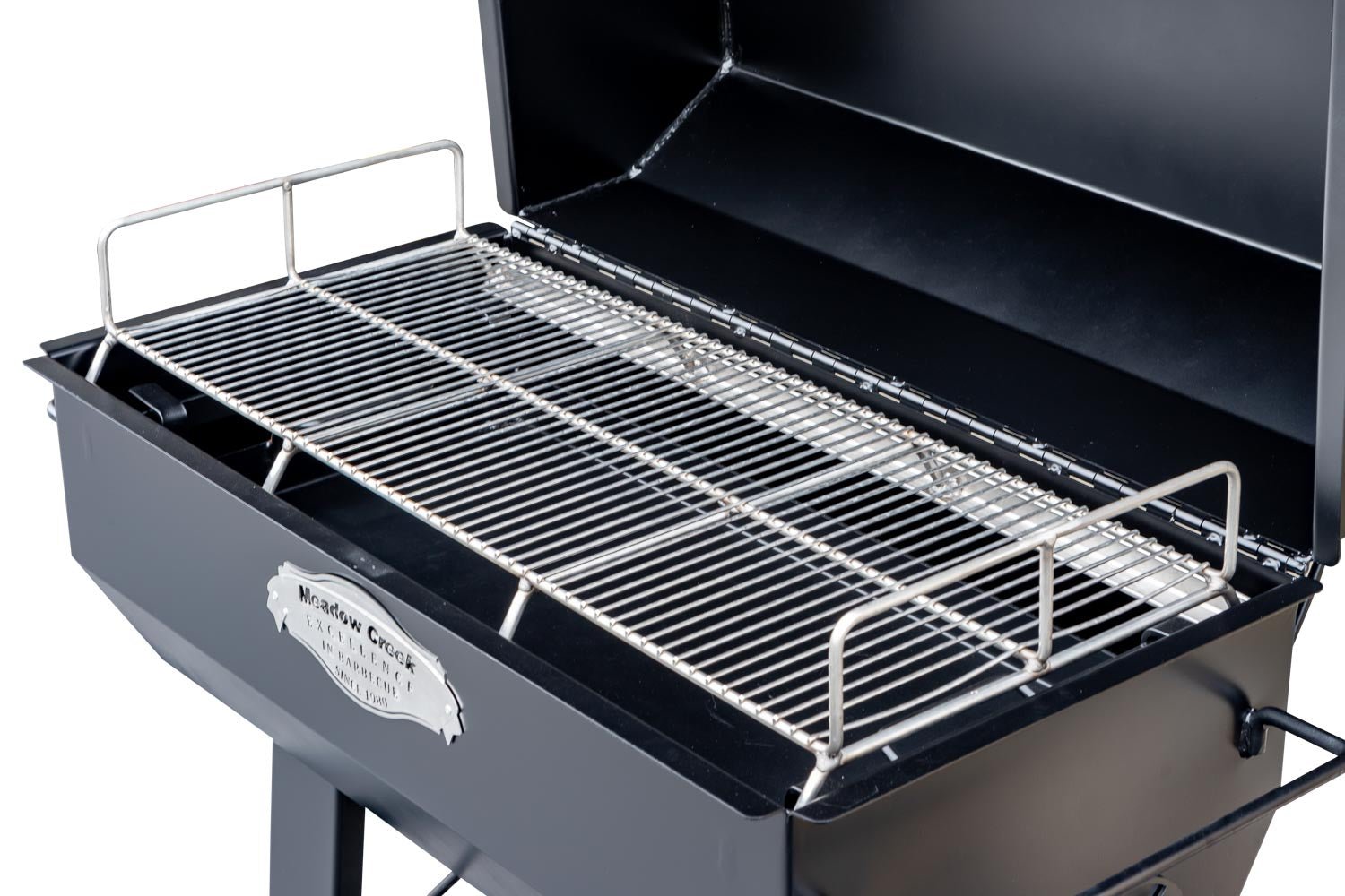 A close-up of the grilling surface on the Meadow Creek PR36 pig roaster, highlighting the stainless steel cooking grates.