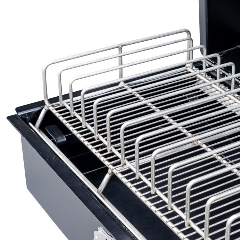 A close-up of the upper grilling rack on the Meadow Creek PR36 pig roaster, emphasizing the durable stainless steel construction and ample cooking space.