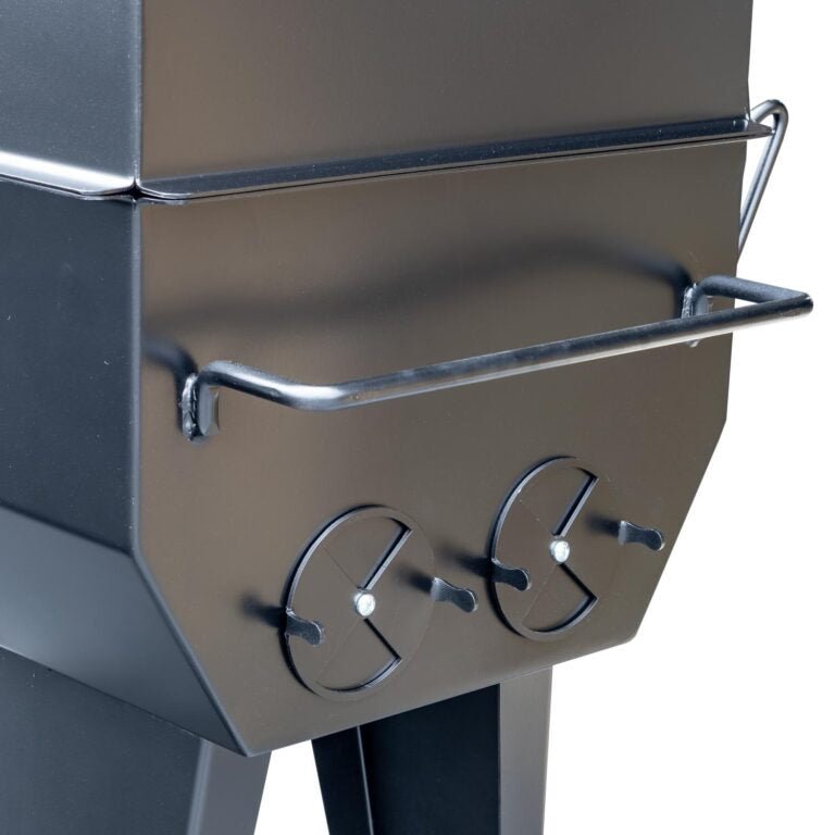 A close-up of the vent controls on the Meadow Creek PR36 pig roaster, emphasizing the adjustable air flow mechanisms.