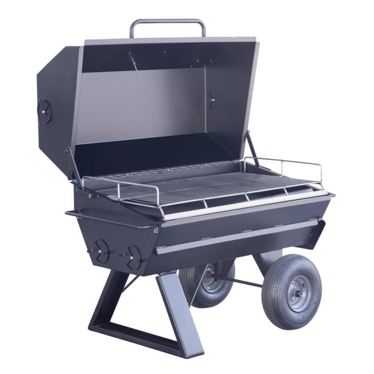 A side angle of the Meadow Creek PR42 pig roaster, showcasing the dual-layer grilling racks and the sturdy design of the unit.