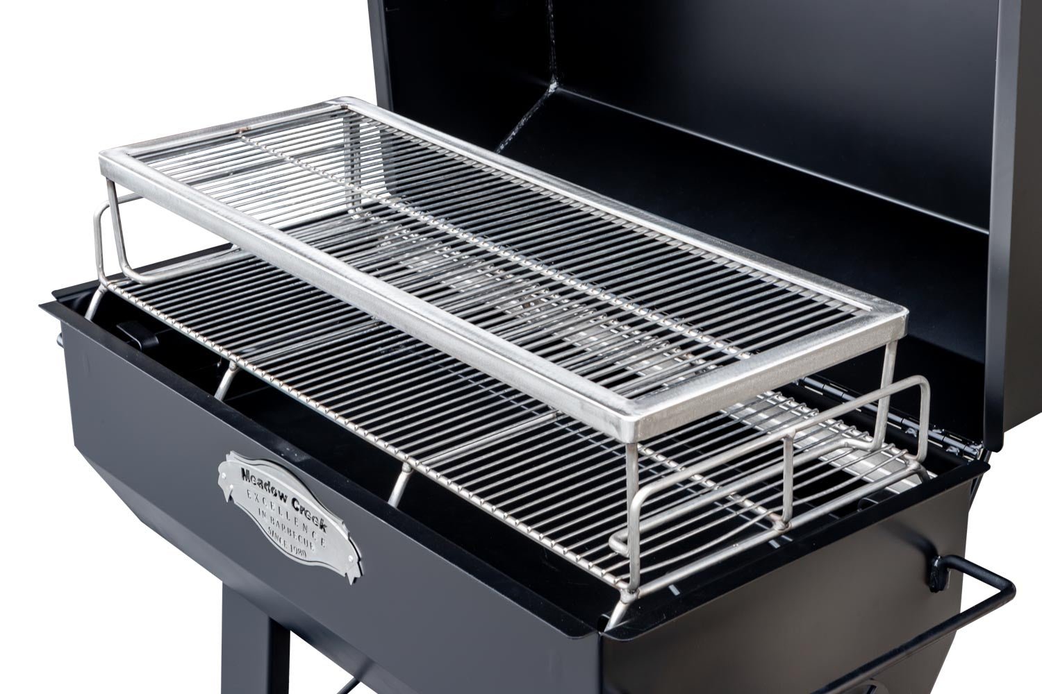 A close-up of the upper grilling rack on the Meadow Creek PR36 pig roaster, emphasizing the durable stainless steel construction and ample cooking space.