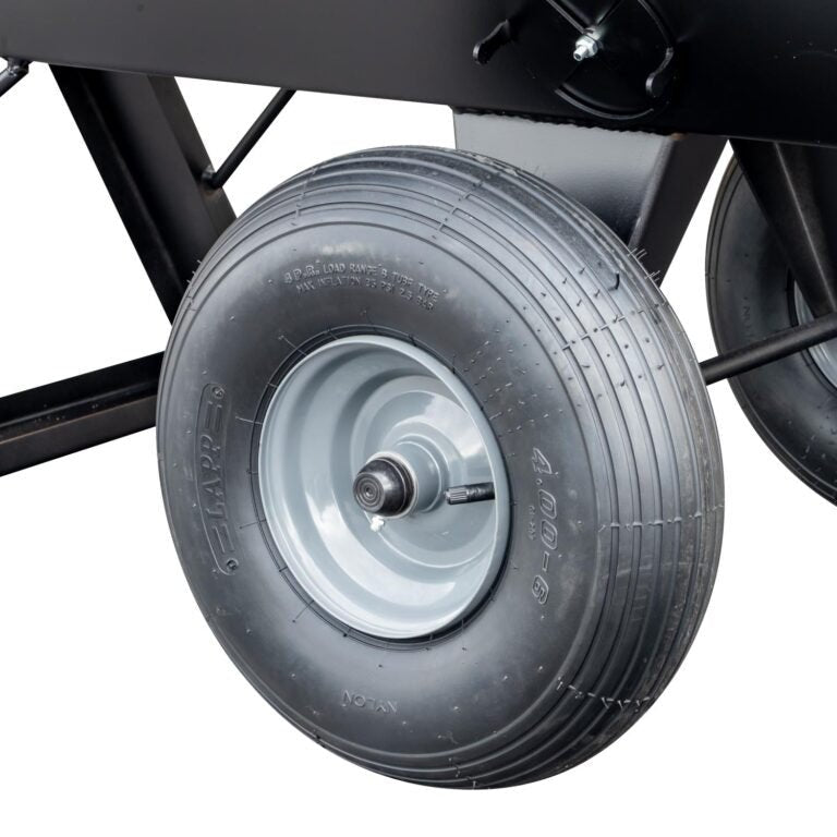 A close-up view of the pneumatic tire on a Meadow Creek smoker and cooker, showing the durable rubber construction and metal rim for enhanced mobility and stability.