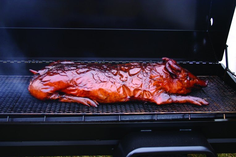 Whole crispy hog inside the Meadow Creek Pig Roaster