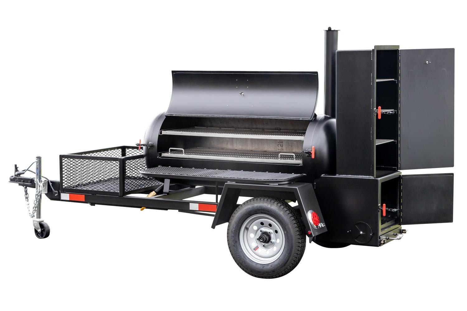 Close-up view of the warming box and firebox of a Meadow Creek BBQ smoker trailer, with open doors and visible shelves inside.