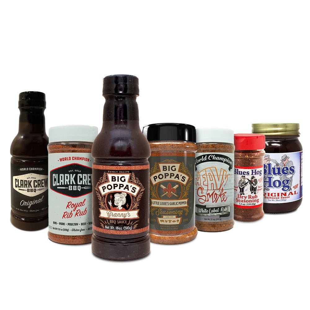 Collection of various barbecue sauces and seasonings on a white background