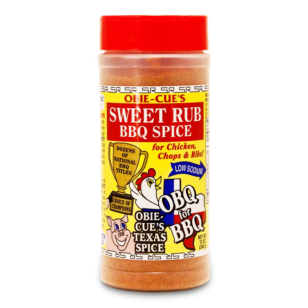 Front view of Obie-Cue's Sweet Rub BBQ Spice bottle. The label features a cartoon chicken and pig and emphasizes the product as a low sodium BBQ spice for chicken, chops, and ribs. It also notes that the spice blend has received numerous national BBQ awards.