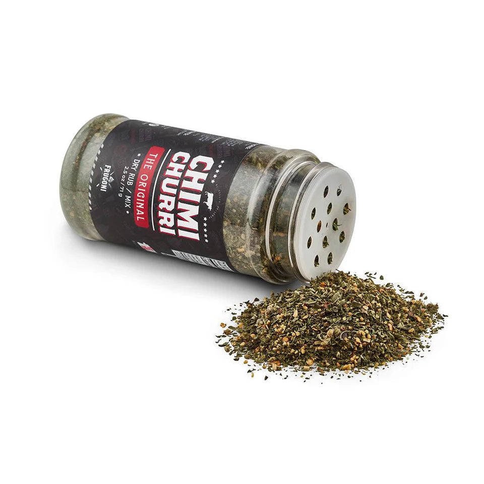 A jar of Frugoni's Original Chimichurri dry rub/mix tipped over, with the mix spilling out in front of a white background.