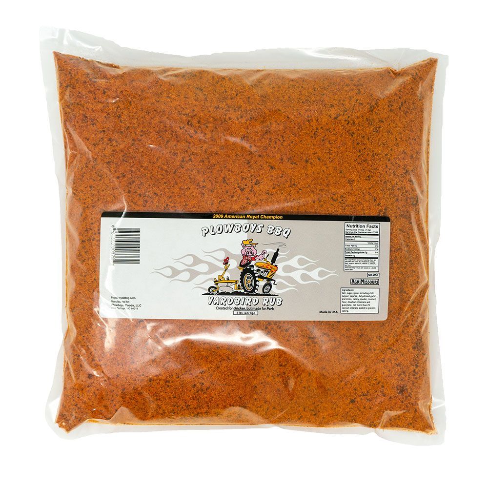 A 5-pound bag of Plowboys BBQ Yardbird Rub, a blend of spices packaged in a clear plastic bag with a label featuring a cartoon pig driving a tractor. The label also includes nutritional information and the text '2009 American Royal Champion'.