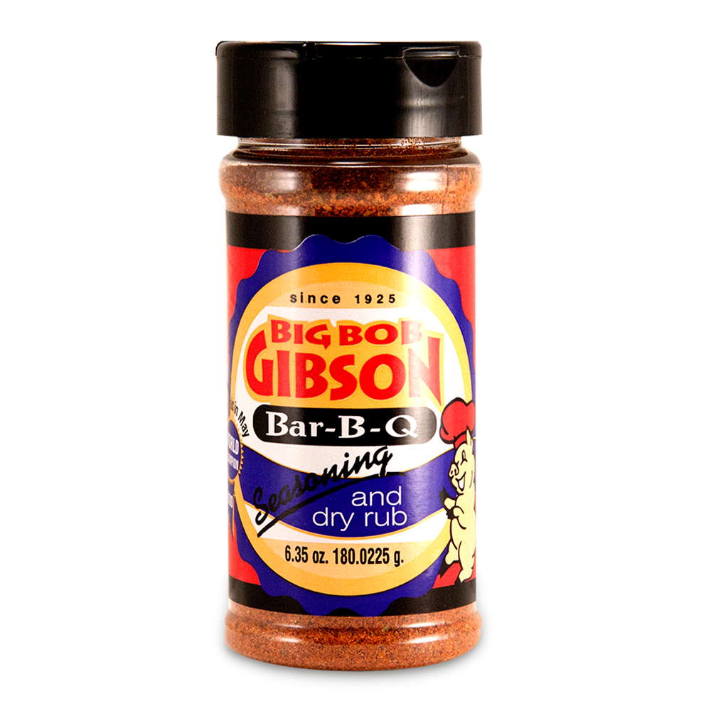 Big Bob Gibson Bar-B-Q Seasoning and Dry Rub in a 6.35 oz bottle. The label displays the brand name in red with a yellow background and includes a cartoon chef on the right. The seasoning inside is a reddish-brown color.
