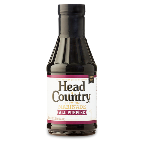 Bottle of Head Country's Premium BBQ Marinade, labeled as the best in the nation for enhancing the flavors of beef, chicken, and pulled pork. Free from MSG, gluten, and trans fats, ensuring a healthy and delicious addition to any BBQ dish.