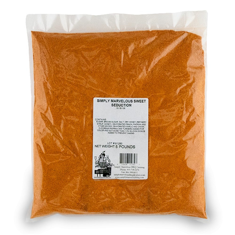 A large, clear plastic bag filled with a reddish-brown seasoning labeled 'Simply Marvelous Sweet Seduction.' The label lists ingredients including sugar, brown sugar, salt, dry honey, dehydrated onion, dehydrated garlic, paprika, and turmeric. The net weight is 5 pounds. The label also features a barcode and the Simply Marvelous BBQ & Catering contact information.