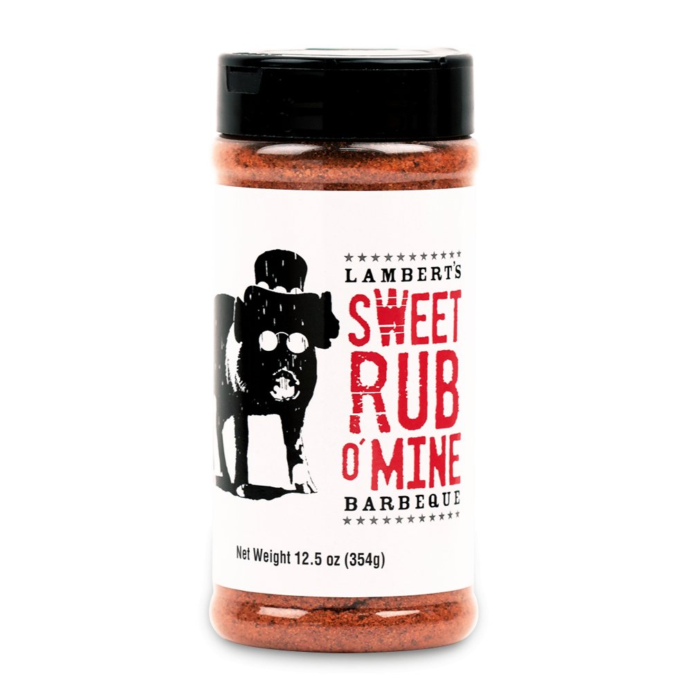 The front of a container of Lambert's Sweet Rub O' Mine Barbeque with a black cap. The label features a black and white illustration of a pig wearing sunglasses and a hat, alongside the product name in bold red and black text. The container holds 12.5 oz (354g) of seasoning.