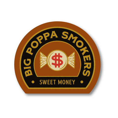 A logo design for Big Poppa Smokers titled "Sweet Money". The logo is in an oval shape with a brown and black color scheme. It features a central motif of a stylized dollar sign with wings on a cream-colored circle, surrounded by the text "Big Poppa Smokers" at the top and "Sweet Money" at the bottom, all set against a dark brown background.